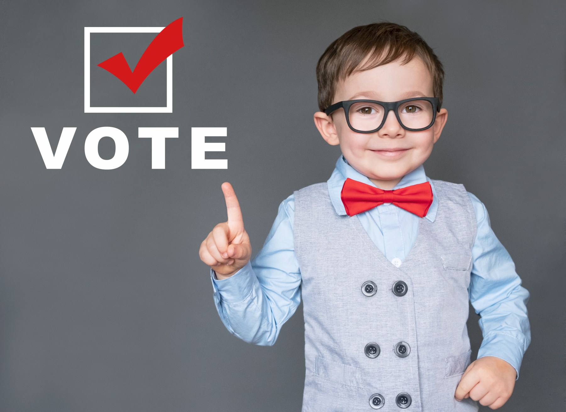 A child beside a checkmark and the word vote