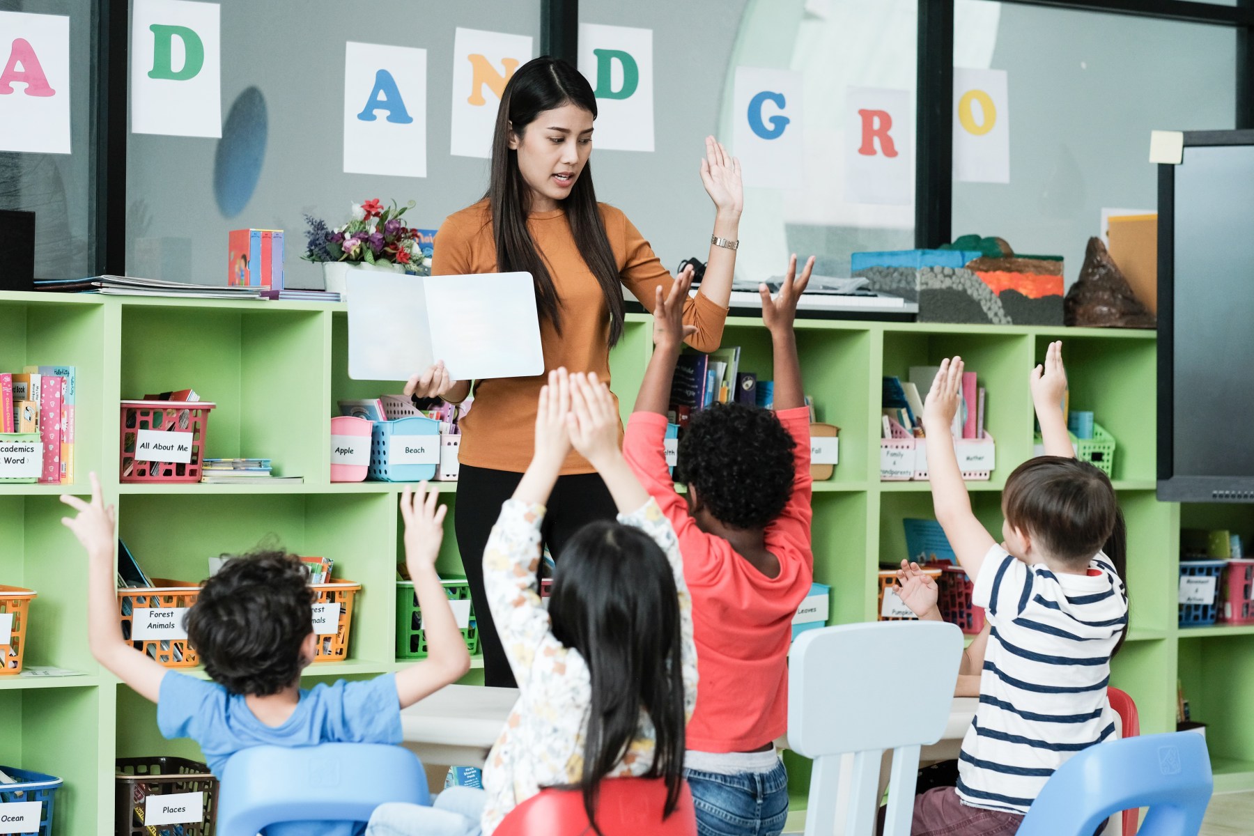A teacher leading an engaged classroom of students
